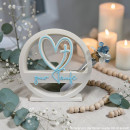 Tauf-Deko mit Herz- und Kreuzmotiv, „zur Taufe“-Schriftzug und kleinem Glasröhrchen mit Trockenblumen,